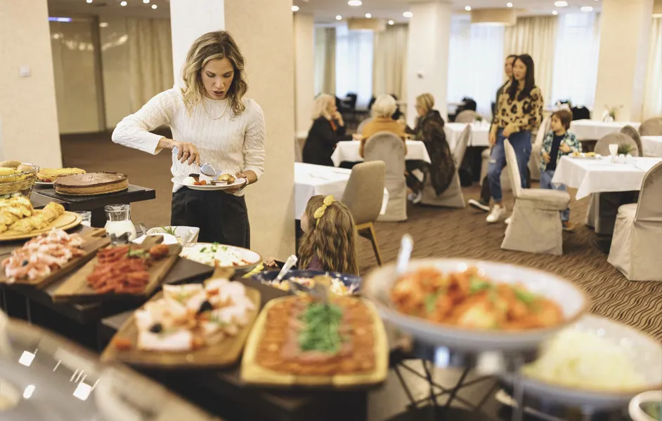 family enjoying breakfast in a hotel - Hotels Near the Van Gogh Museum